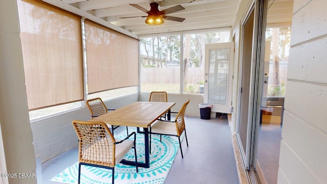 sunroom / solarium featuring ceiling fan