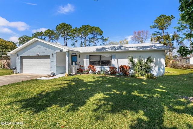 ranch-style house featuring a garage and a front lawn