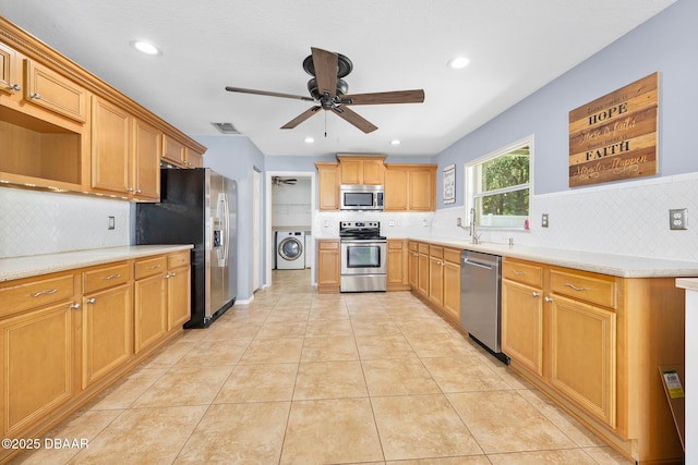 5 Cantilever Ct, Ormond Beach, FL 32174 - kitchen with stainless steel appliances, washer / clothes dryer, decorative backsplash, ceiling fan, and recessed lighting