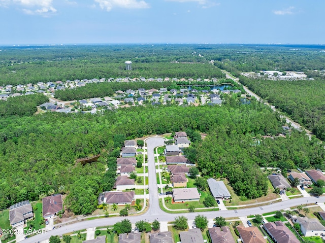 5 Cantilever Ct, Ormond Beach, FL 32174 - aerial overview of property's location featuring a heavily wooded area, nearby suburban area, and a large body of water