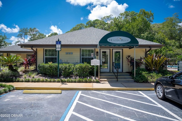 5 Cantilever Ct, Ormond Beach, FL 32174 - view of front of property with uncovered parking and a shingled roof