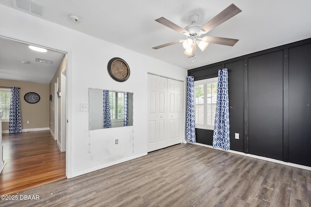 5 Cantilever Ct, Ormond Beach, FL 32174 - unfurnished bedroom with wood finished floors, baseboards, and a ceiling fan