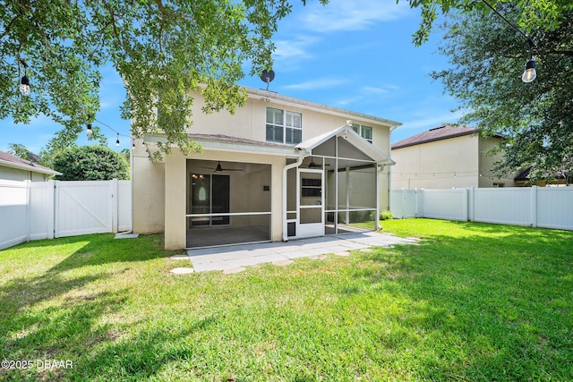 5 Cantilever Ct, Ormond Beach, FL 32174 - rear view of property featuring a ceiling fan, a gate, a sunroom, stucco siding, and a patio area