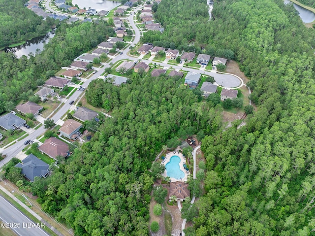 5 Cantilever Ct, Ormond Beach, FL 32174 - aerial overview of property's location with a large body of water, a pool area, and nearby suburban area