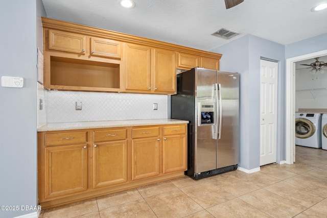5 Cantilever Ct, Ormond Beach, FL 32174 - kitchen with stainless steel fridge, washer and clothes dryer, ceiling fan, tasteful backsplash, and light tile patterned floors