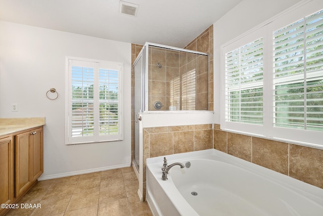 5 Cantilever Ct, Ormond Beach, FL 32174 - full bathroom featuring a shower stall, a bath, vanity, tile patterned flooring, and baseboards