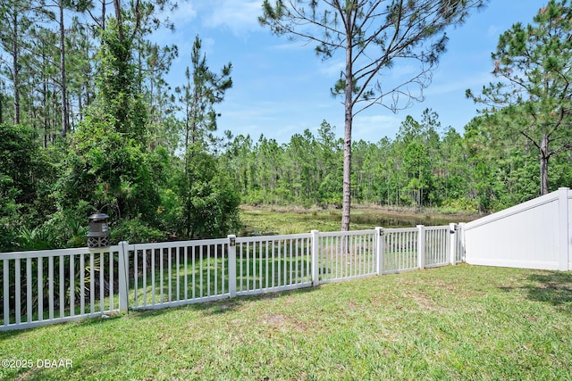 5 Cantilever Ct, Ormond Beach, FL 32174 - view of yard featuring a wooded view and a gate