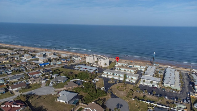 birds eye view of property with a view of the beach and a water view