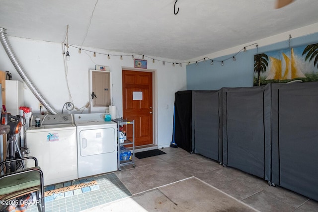 laundry area with washer and dryer and electric panel