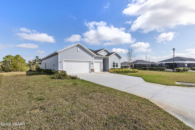 ranch-style home with a garage and a front yard