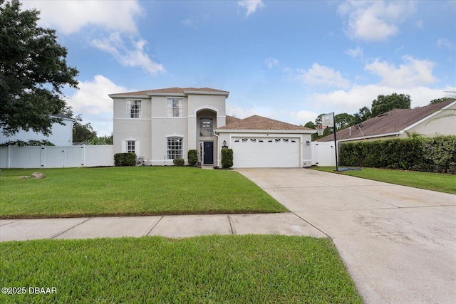 mediterranean / spanish home featuring a gate, stucco siding, concrete driveway, and a front lawn
