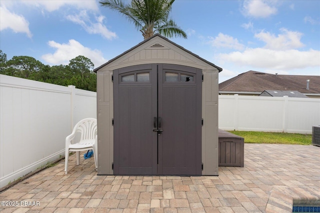 view of shed featuring a fenced backyard