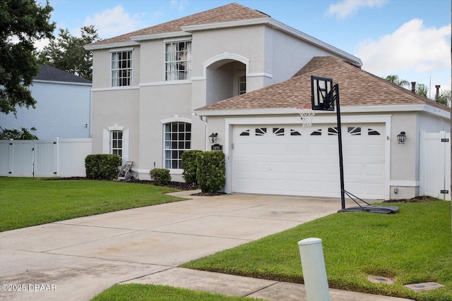 traditional home featuring fence, a front yard, stucco siding, an attached garage, and driveway