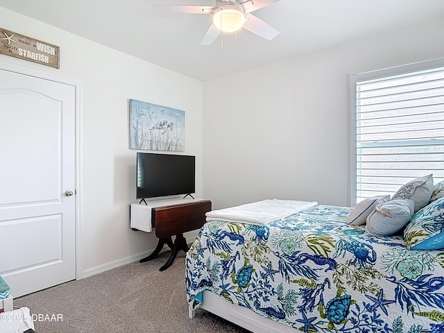 2778 Portadown St, Ormond Beach, FL 32174 - carpeted bedroom with a ceiling fan and baseboards