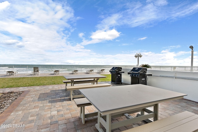 exterior space with a patio area and a water view