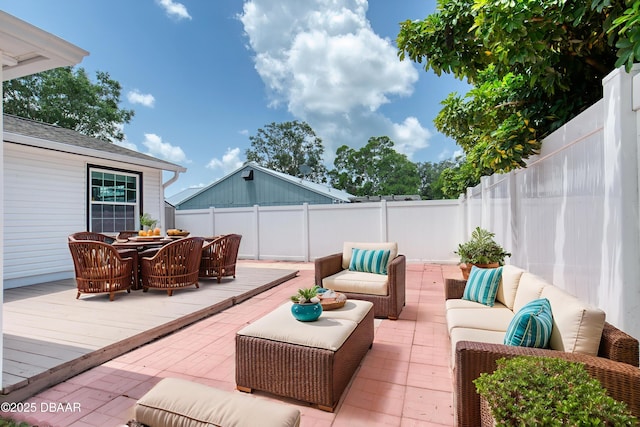 952 Northbrook Dr, Ormond Beach, FL 32174 - fenced backyard featuring an outdoor hangout area, a deck, and outdoor dining space
