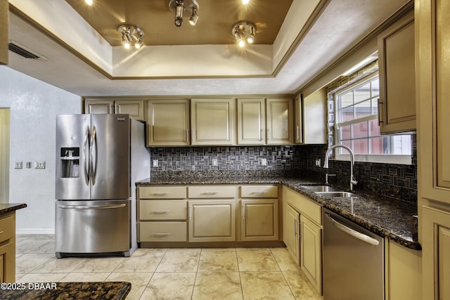 952 Northbrook Dr, Ormond Beach, FL 32174 - kitchen with stainless steel appliances, a raised ceiling, decorative backsplash, and a sink