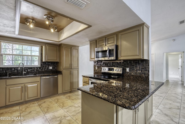 952 Northbrook Dr, Ormond Beach, FL 32174 - kitchen with stainless steel appliances, a sink, backsplash, and dark stone countertops