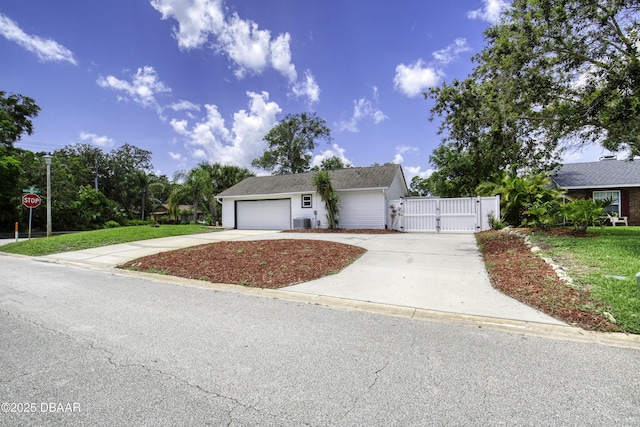 952 Northbrook Dr, Ormond Beach, FL 32174 - view of front facade with a gate, concrete driveway, and an attached garage