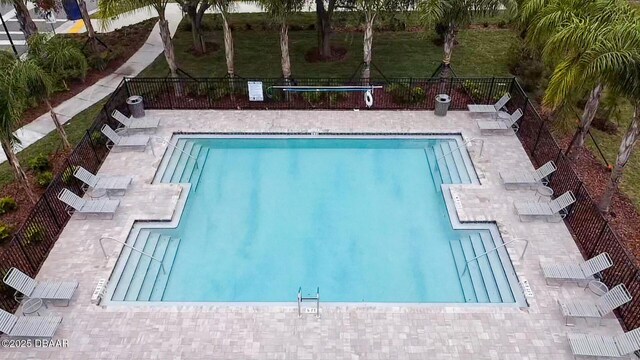 2716 Golden Trout Ln, Edgewater, FL 32141 - community pool featuring a patio