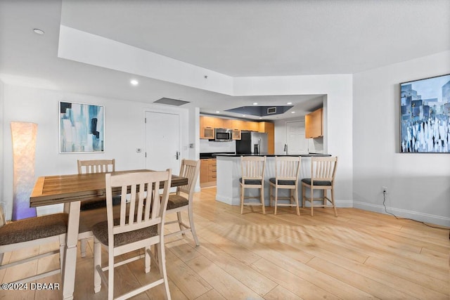 231 Riverside Dr Unit 1904, Holly Hill, FL 32117 - dining space featuring baseboards, light wood-style floors, and recessed lighting