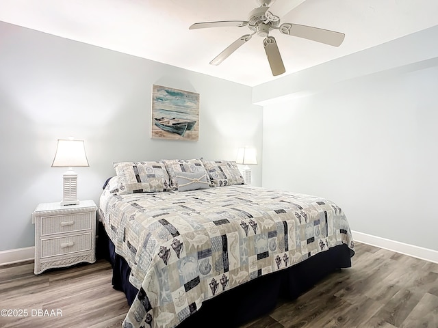 bedroom featuring hardwood / wood-style floors and ceiling fan