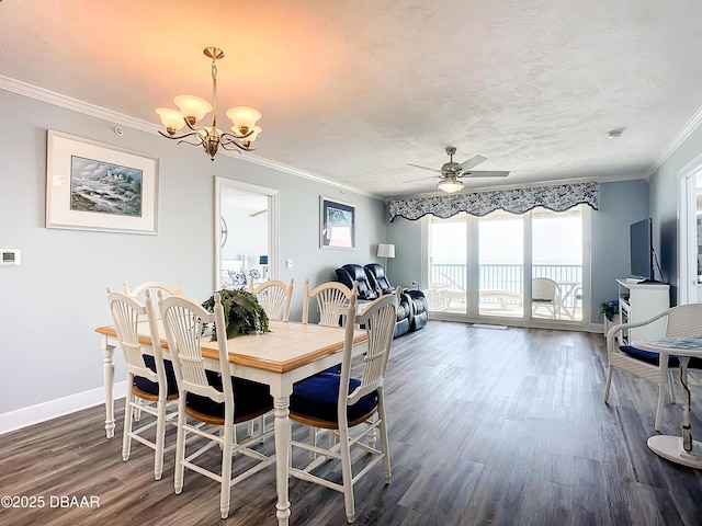 dining room with crown molding, dark hardwood / wood-style flooring, ceiling fan with notable chandelier, and a textured ceiling