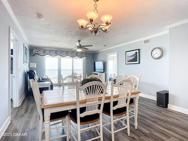 dining room with crown molding, dark wood-type flooring, a textured ceiling, and ceiling fan with notable chandelier