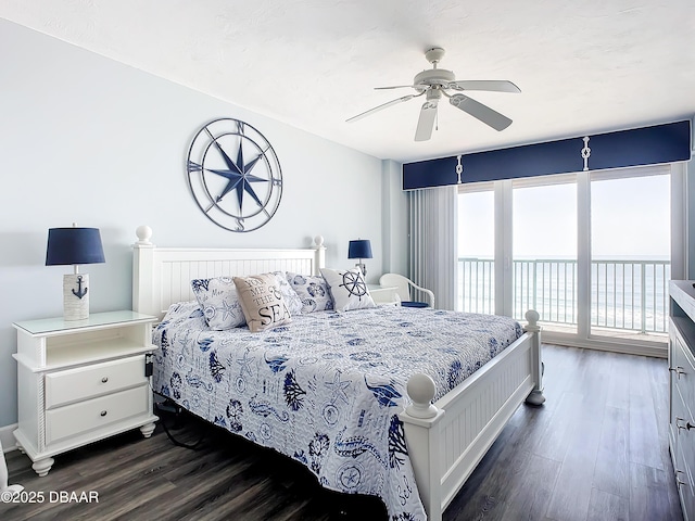 bedroom featuring ceiling fan, dark hardwood / wood-style flooring, and access to outside