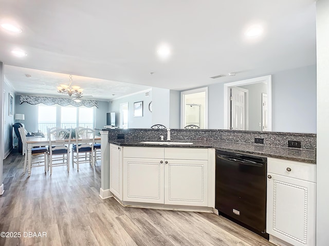 kitchen featuring white cabinetry, black dishwasher, sink, and light hardwood / wood-style flooring