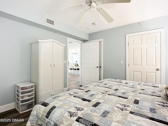 bedroom with hardwood / wood-style floors and ceiling fan