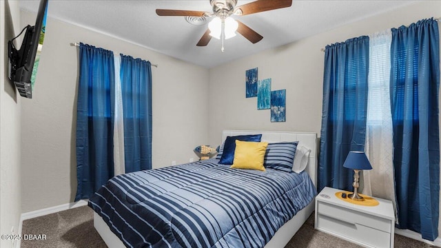 carpeted bedroom with baseboards and ceiling fan