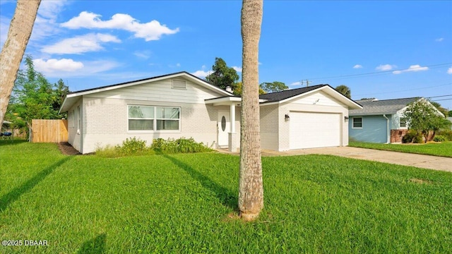 ranch-style house featuring brick siding, a front lawn, fence, driveway, and an attached garage