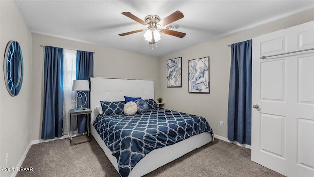 carpeted bedroom featuring a ceiling fan and baseboards