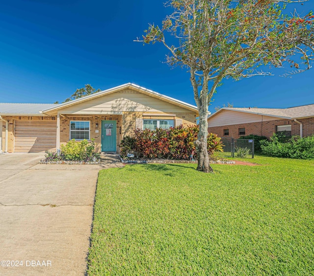 25 Laughing Gull Ln, Edgewater, FL 32141 - ranch-style house featuring concrete driveway, brick siding, and an attached garage