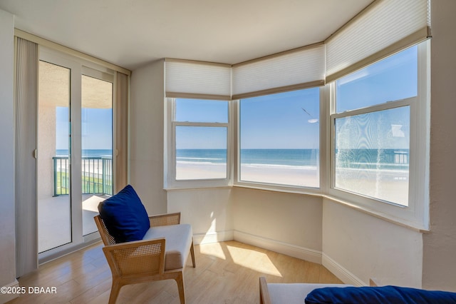 sunroom / solarium with a water view