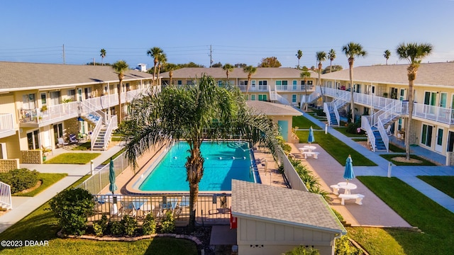 view of swimming pool with a lawn and a patio area