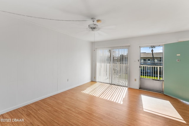 unfurnished room featuring ceiling fan and light wood-type flooring