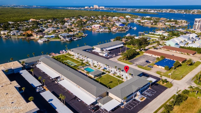 birds eye view of property featuring a water view