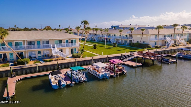 view of dock featuring a balcony and a water view