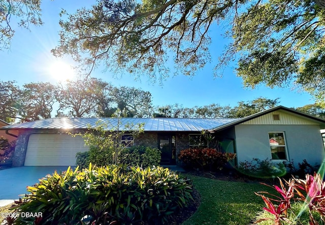 single story home with a garage