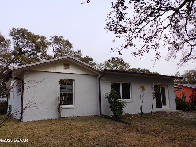 view of home's exterior with a lawn