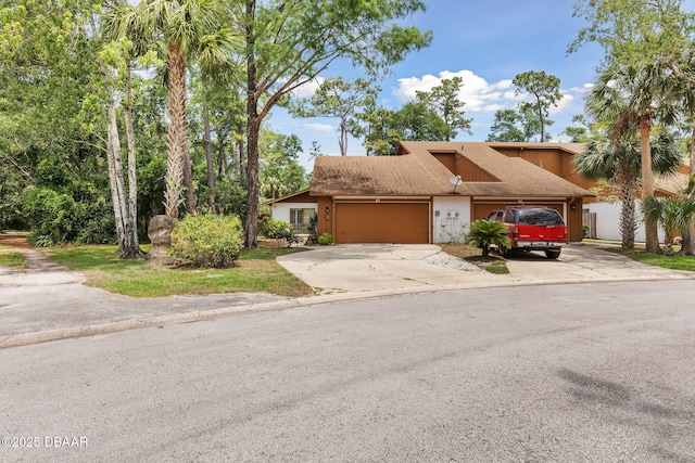 42 Soco Trl, Ormond Beach, FL 32174 - townhome / multi-family property with an attached garage and driveway