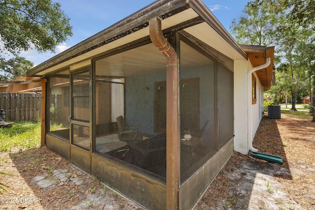 42 Soco Trl, Ormond Beach, FL 32174 - view of patio / terrace featuring a sunroom and cooling unit