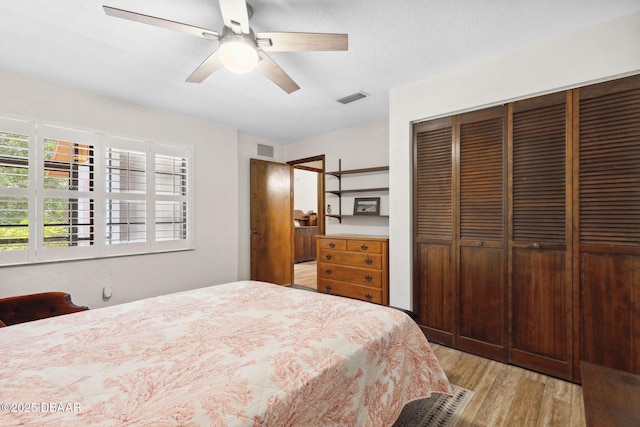 42 Soco Trl, Ormond Beach, FL 32174 - bedroom with light wood-style flooring, a closet, and a ceiling fan