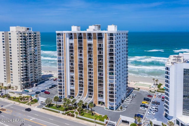 bird's eye view with a view of the beach, a water view, and a city view