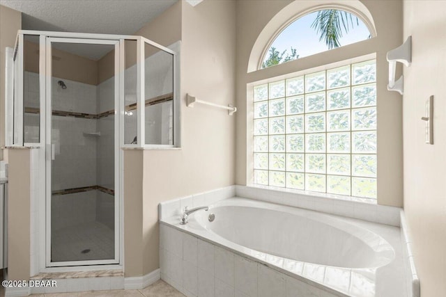 3 Slow Stream Way, Ormond Beach, FL 32174 - bathroom with a garden tub, plenty of natural light, a stall shower, and tile patterned floors