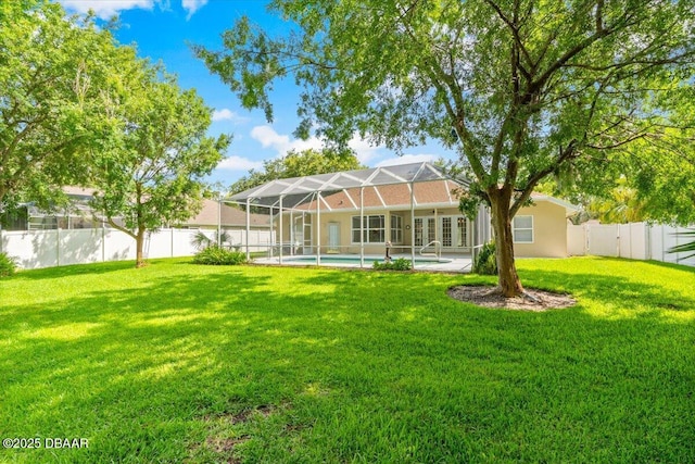 3 Slow Stream Way, Ormond Beach, FL 32174 - back of house featuring a fenced backyard, french doors, a lanai, and a patio