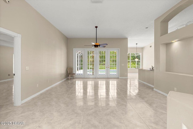 3 Slow Stream Way, Ormond Beach, FL 32174 - empty room featuring french doors, a ceiling fan, and light tile patterned floors