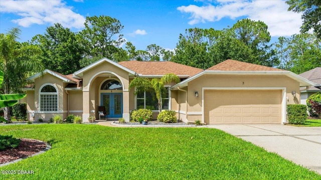 3 Slow Stream Way, Ormond Beach, FL 32174 - view of front facade with french doors, stucco siding, an attached garage, concrete driveway, and a front lawn